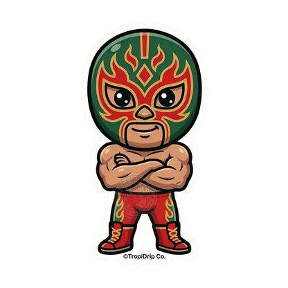 A vibrant chibi-style illustration of a full-body Mexican luchador wrestler designed as a die-cut vinyl sticker. The character is striking a powerful, confident stance with arms crossed, wearing an iconic wrestling mask detailed in bright green, red, and gold patterns. The design is finished with a thick, clean white contour border.